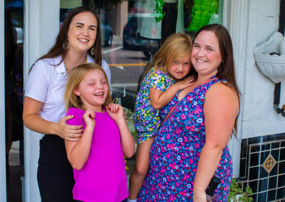 2 women and 2 girls at a party